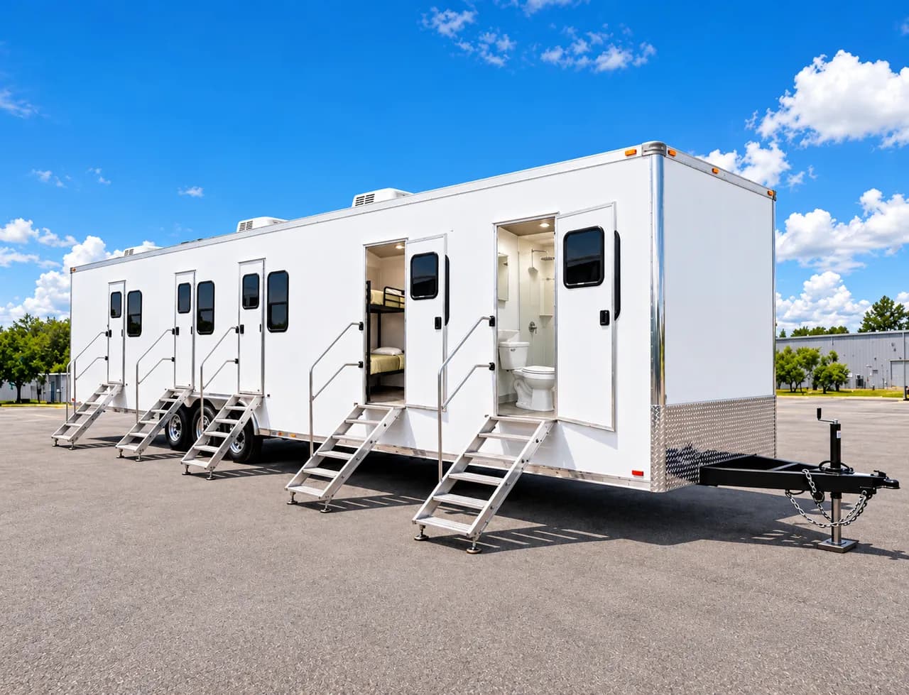 Exterior of a workforce accommodation trailer with several open entrances