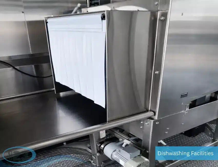 Temporary dishwashing trailer supporting emergency food operations with sanitary cleaning and warewashing facilities.