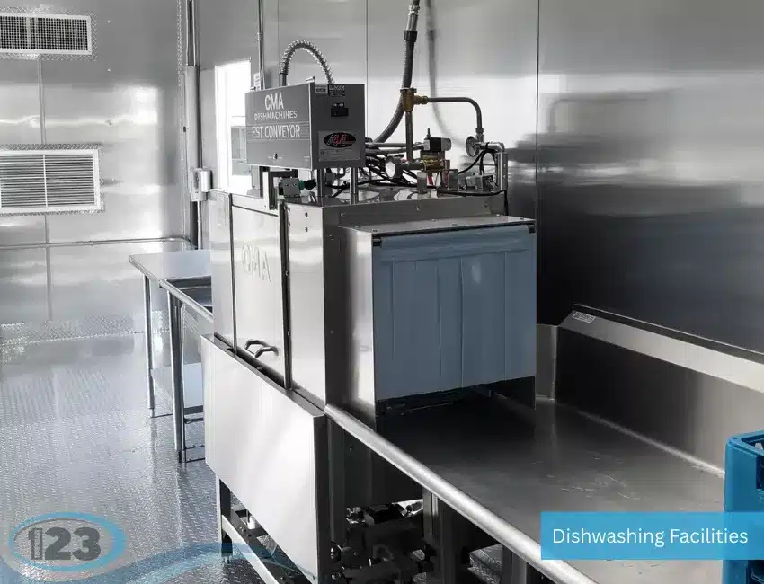 Industrial dishwashing trailer equipped with high-capacity workstations for efficient cleaning of food service equipment.