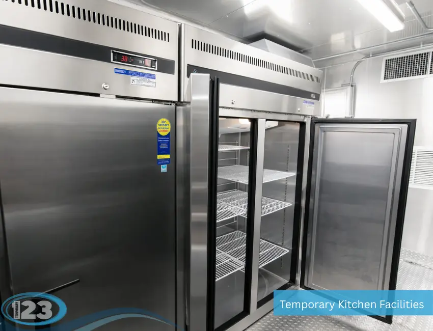 Commercial kitchen trailer with dedicated food preparation stations, stainless steel countertops, and professional catering equipment.