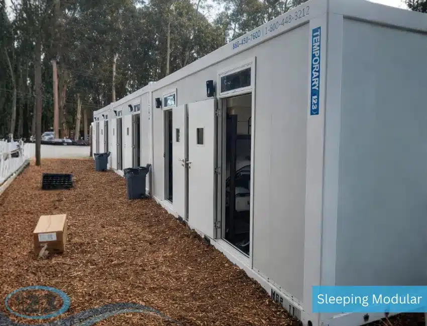 Portable dormitory container with multiple bunk beds and efficient living space designed to accommodate large work crews.